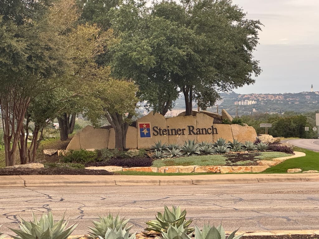 Steiner Ranch rooftops on the ridges above Lake Austin in western Travis County